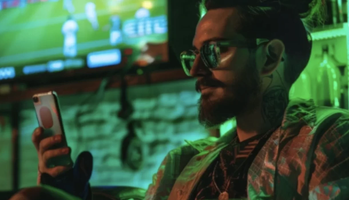 a man looks at his phone